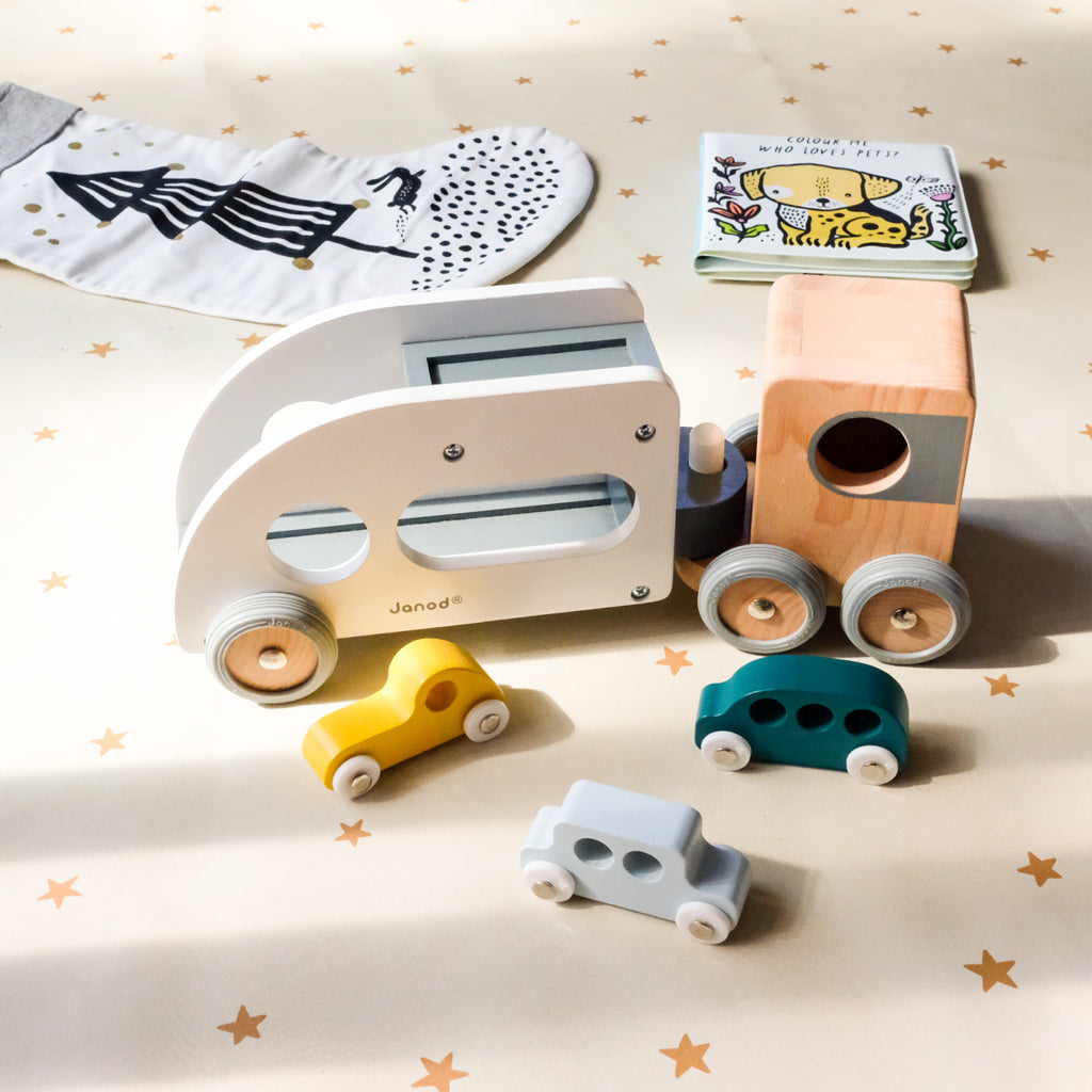 Janod Car Carrier with vehicles with Wee Gallery Christmas stocking and bath book UrbanBaby Shop